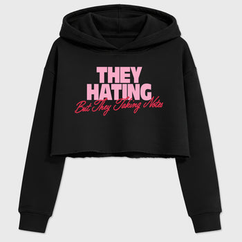 They Hating But Taking Notes women’s crop tee designed to match the Air Jordan 1 Travis Scott Tropical Pink, featuring coordinated Black 2 options for a perfect streetwear vibe.
