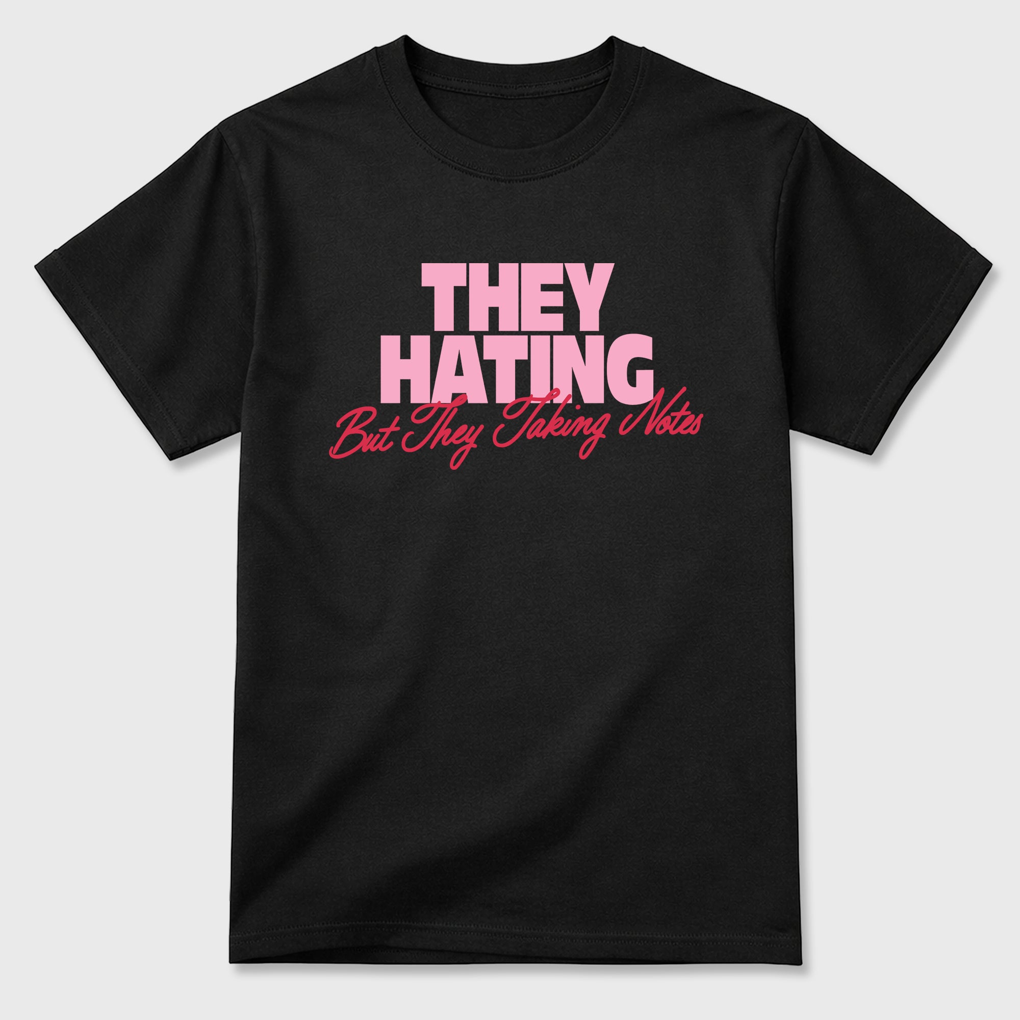 They Hating But Taking Notes Graphic T-Shirt sneaker match tee designed for the Air Jordan 1 Travis Scott Tropical Pink, featuring coordinated color options for a perfect streetwear match. Black 2 shirt.