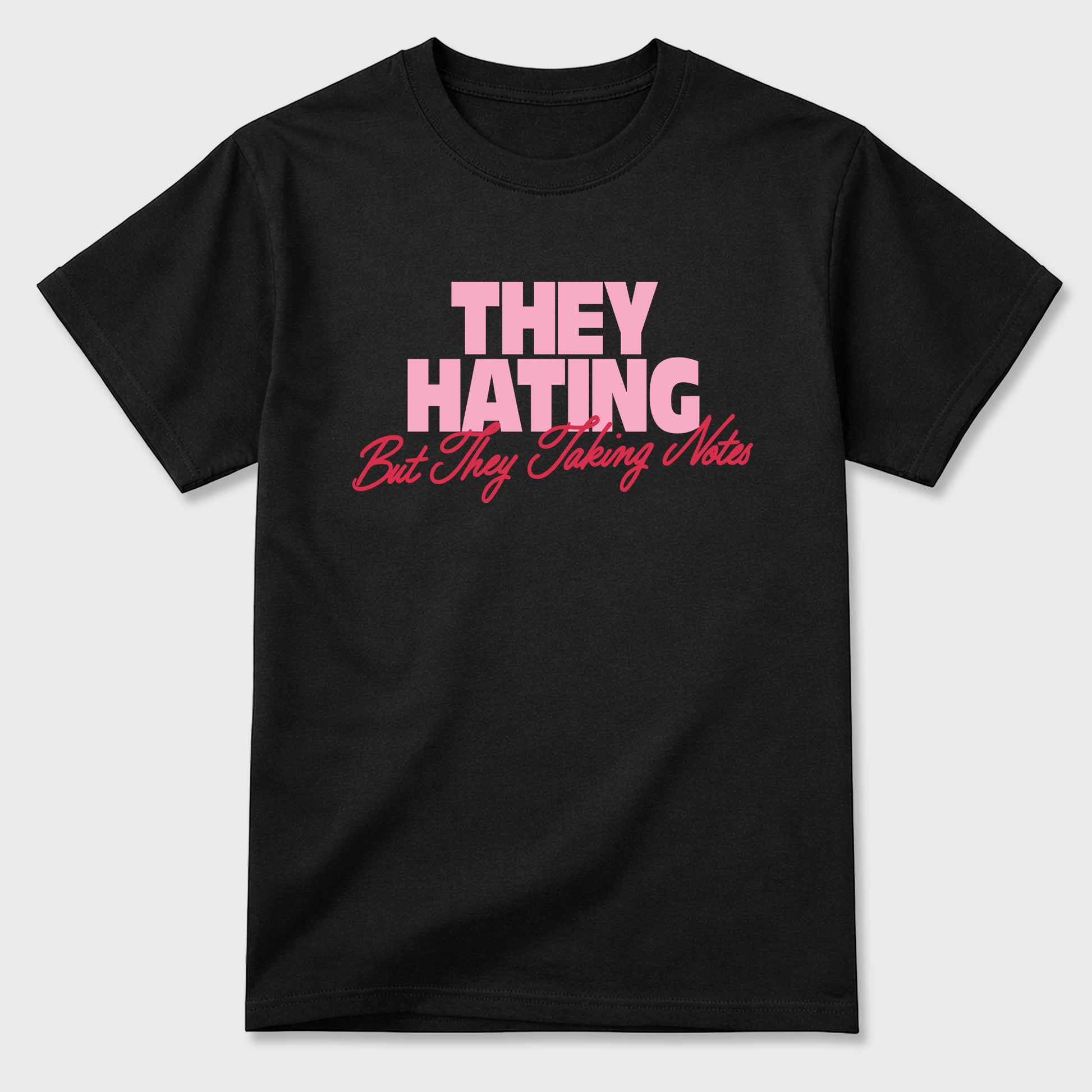 They Hating But Taking Notes Graphic T-Shirt sneaker match tee designed for the Air Jordan 1 Travis Scott Tropical Pink, featuring coordinated color options for a perfect streetwear match. Black 2 shirt.