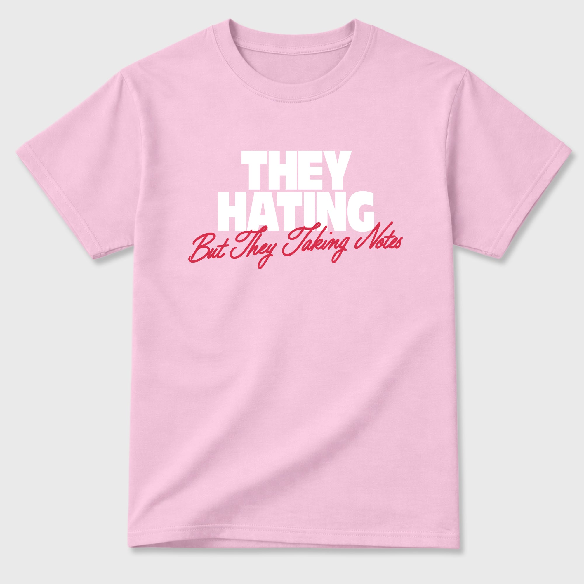 They Hating But Taking Notes Graphic T-Shirt sneaker match tee designed for the Air Jordan 1 Travis Scott Tropical Pink, featuring coordinated color options for a perfect streetwear match. Pink 2 shirt.