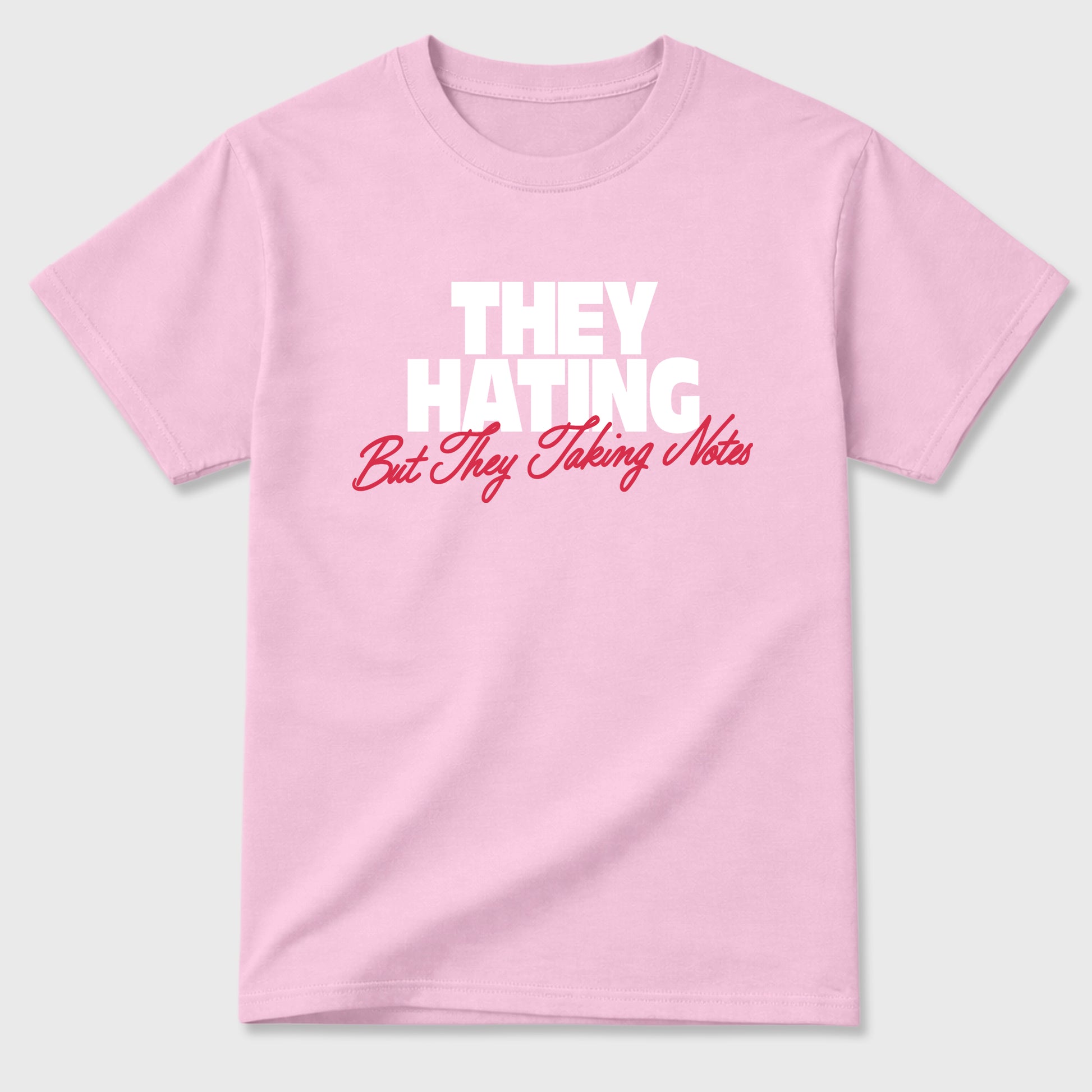 They Hating But Taking Notes Graphic T-Shirt sneaker match tee designed for the Air Jordan 1 Travis Scott Tropical Pink, featuring coordinated color options for a perfect streetwear match. Pink 2 shirt.