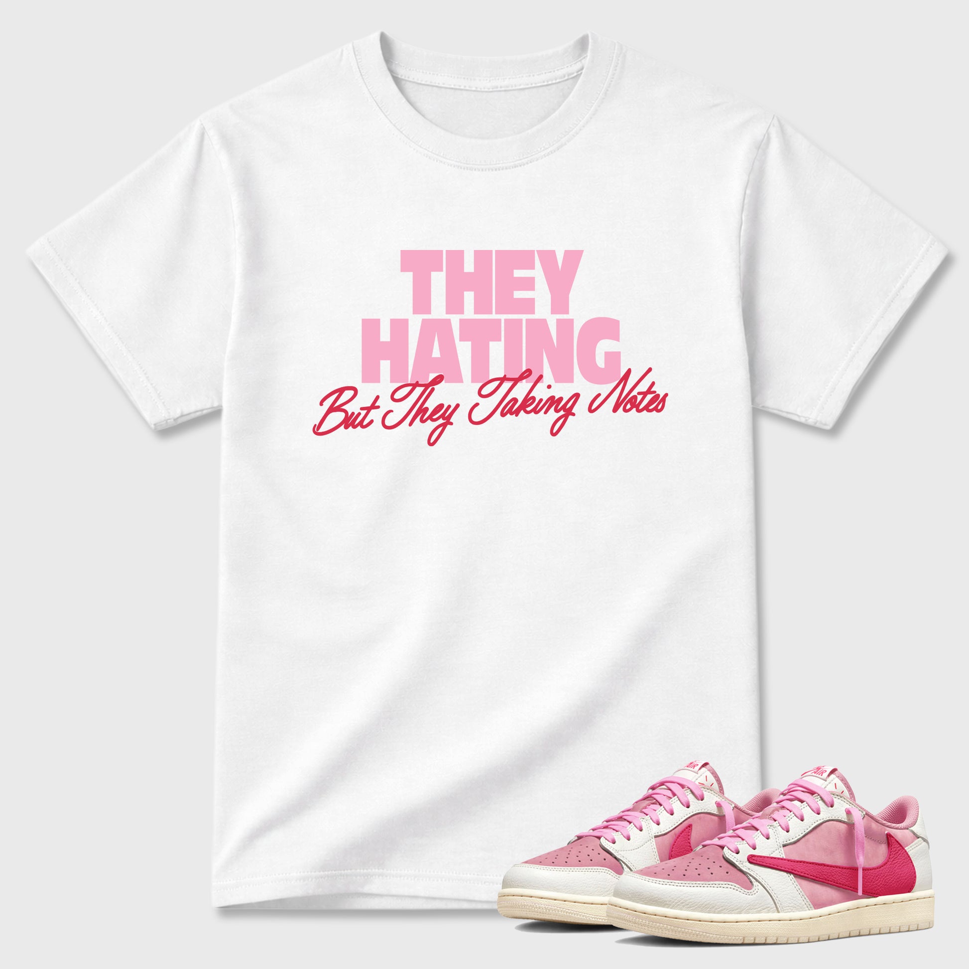 They Hating But Taking Notes Graphic T-Shirt sneaker match tee designed for the Air Jordan 1 Travis Scott Tropical Pink, featuring coordinated color options for a perfect streetwear match. White 1 shirt.
