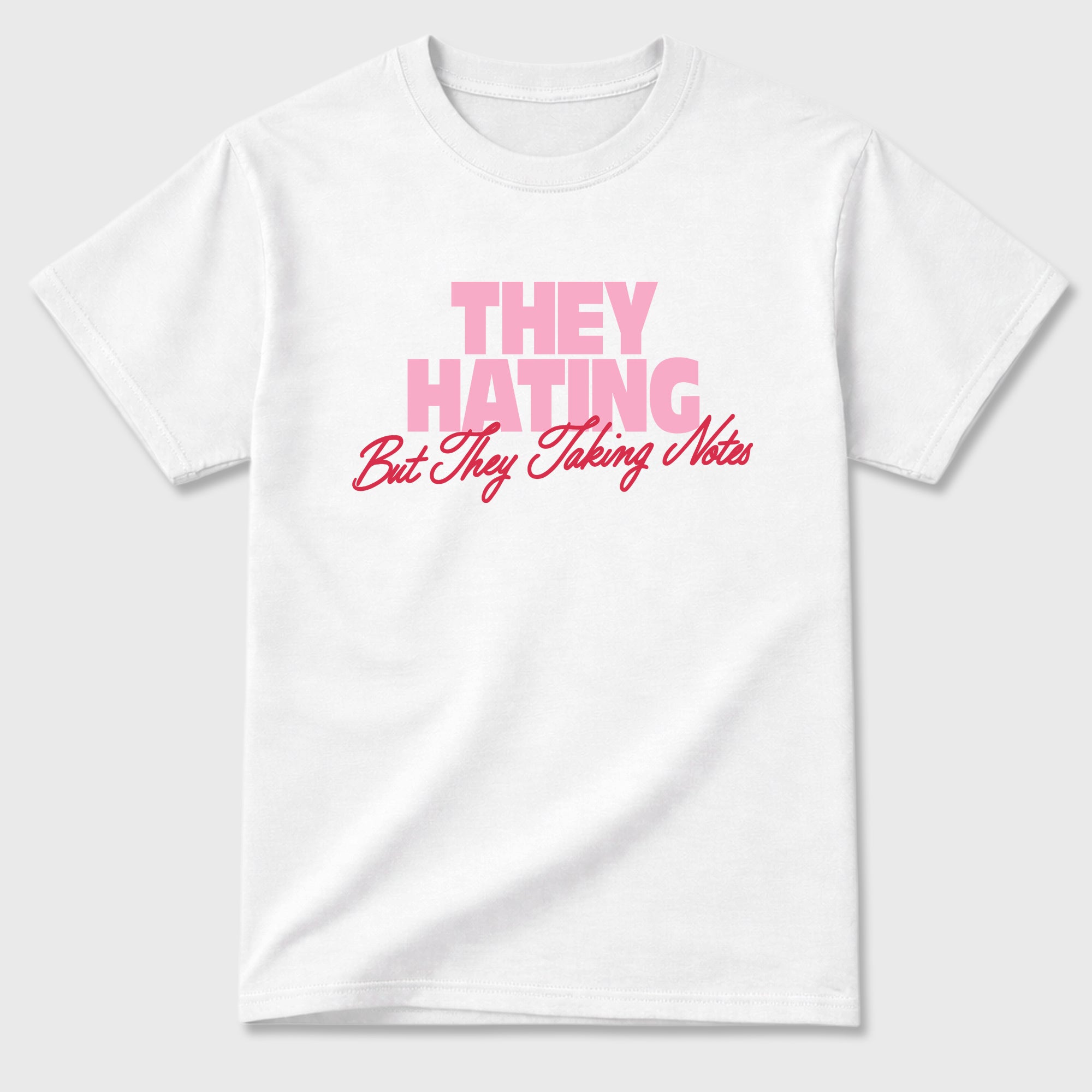 They Hating But Taking Notes Graphic T-Shirt sneaker match tee designed for the Air Jordan 1 Travis Scott Tropical Pink, featuring coordinated color options for a perfect streetwear match. White 2 shirt.