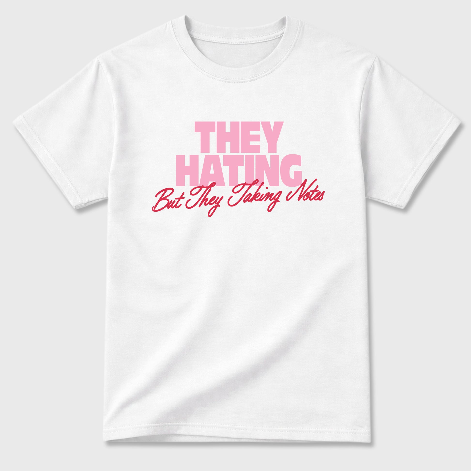 They Hating But Taking Notes Graphic T-Shirt sneaker match tee designed for the Air Jordan 1 Travis Scott Tropical Pink, featuring coordinated color options for a perfect streetwear match. White 2 shirt.