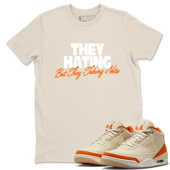 They Hating But Taking Notes sneaker match t-shirt styled to complete your fit with the Air Jordan 3 Starfish sneakers, shown in Natural 1.
