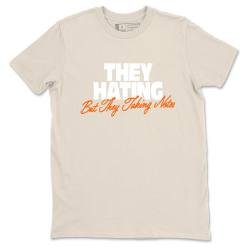 They Hating But Taking Notes sneaker match t-shirt styled to complete your fit with the Air Jordan 3 Starfish sneakers, shown in Natural 2.