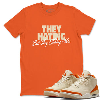 They Hating But Taking Notes sneaker match t-shirt styled to complete your fit with the Air Jordan 3 Starfish sneakers, shown in Orange 1.