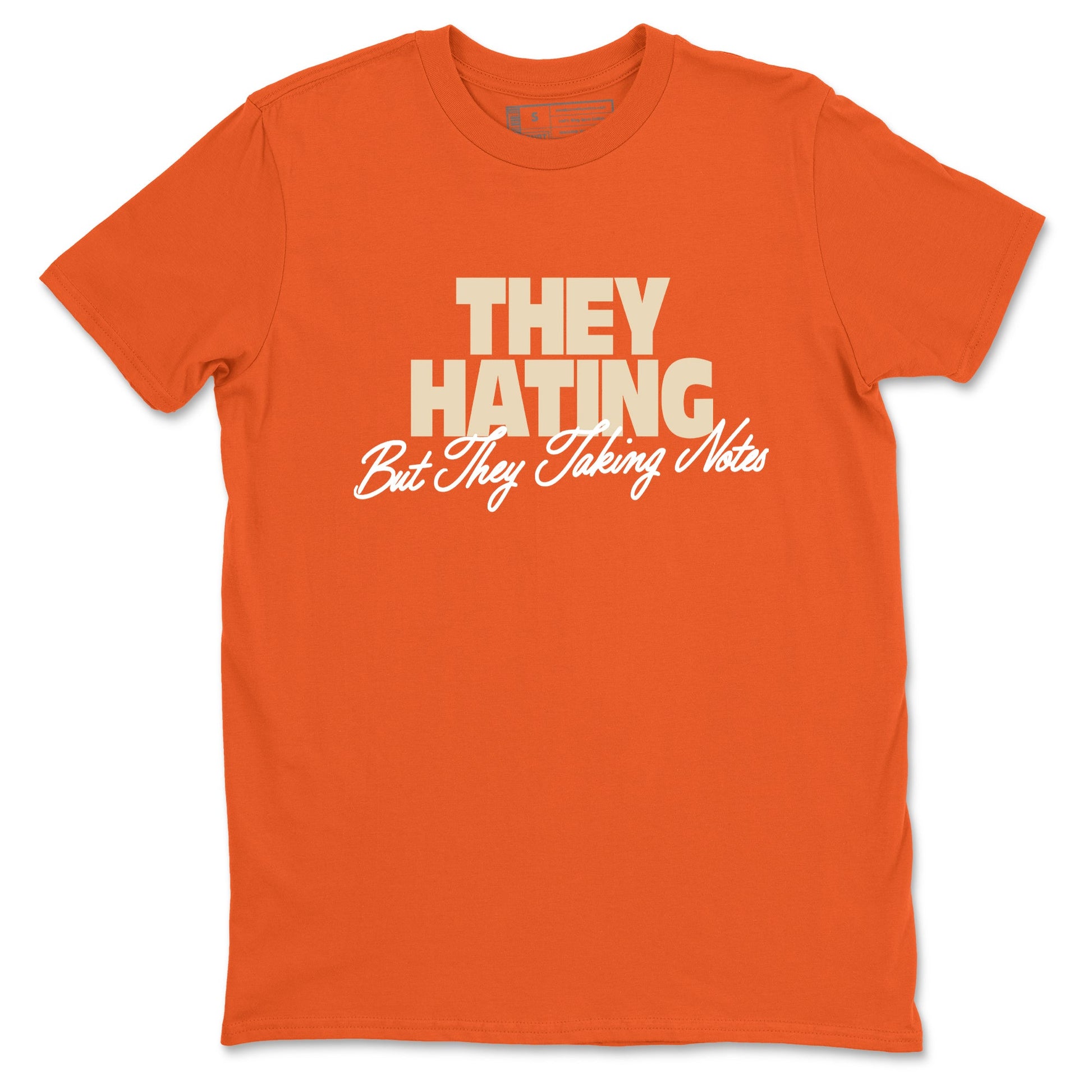 They Hating But Taking Notes sneaker match t-shirt styled to complete your fit with the Air Jordan 3 Starfish sneakers, shown in Orange 2.