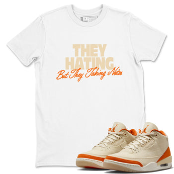 They Hating But Taking Notes sneaker match t-shirt styled to complete your fit with the Air Jordan 3 Starfish sneakers, shown in White 1.