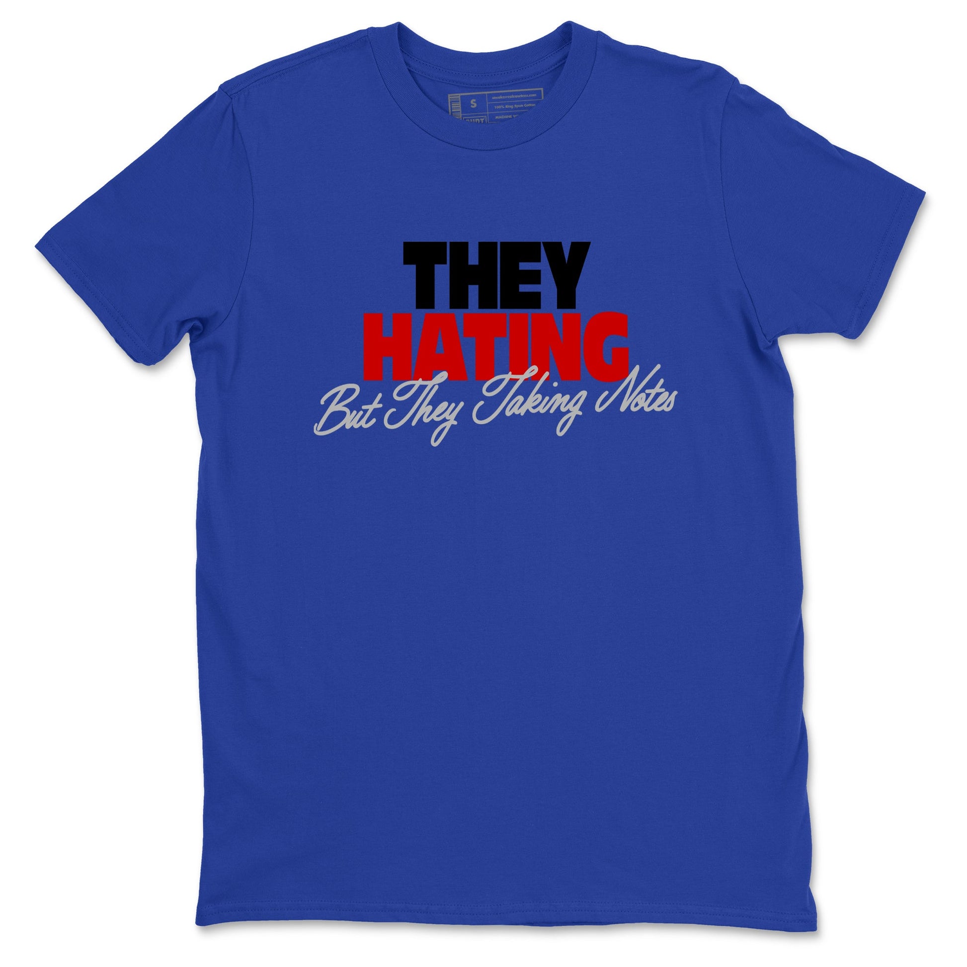 They Hating But Taking Notes sneaker match t-shirt styled to complete your fit with the Air Jordan 4 Rare Air sneakers, shown in Royal Blue 2.