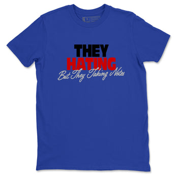 They Hating But Taking Notes sneaker match t-shirt styled to complete your fit with the Air Jordan 4 Rare Air sneakers, shown in Royal Blue 2.