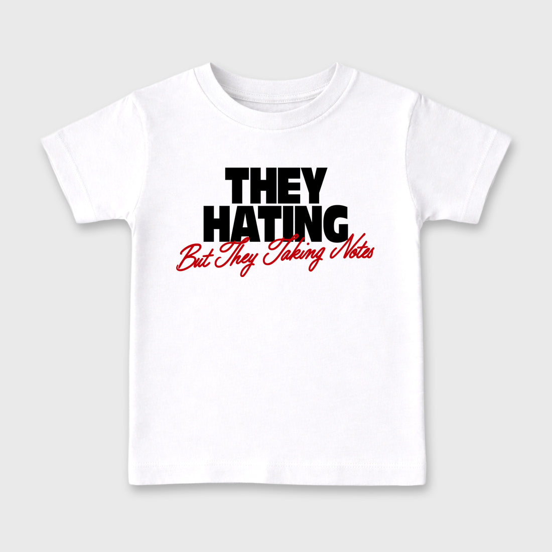 They Hating But Taking Notes Baby & Kids Graphic T-Shirt featuring original artwork designed to match the Air Jordan 9 True Red. White 2 Kids Graphic Tee.