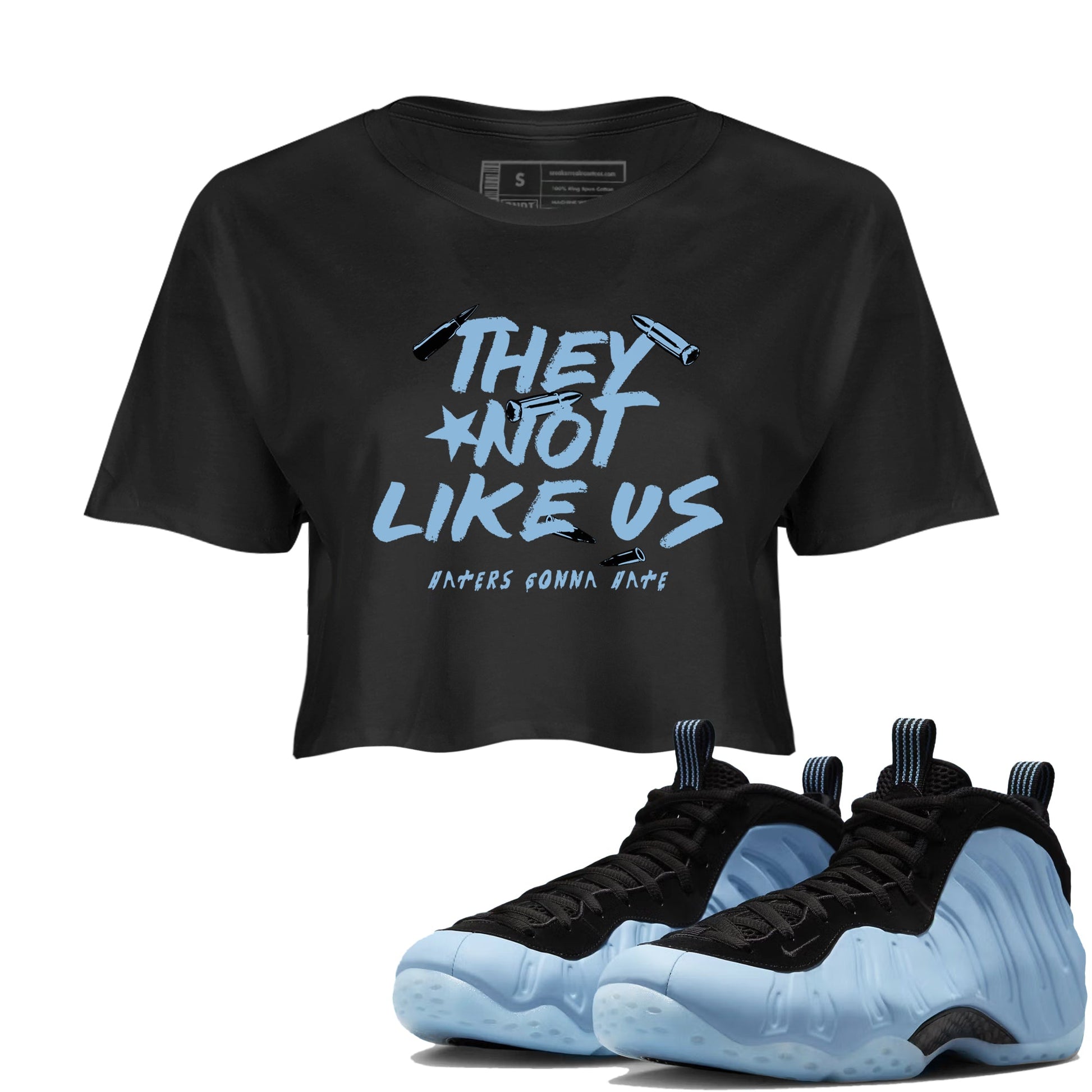 They Not Like Us womens crop tee made to vibe with the Air Foamposite One Psychic Blue sneakers — the perfect match in Black 1.