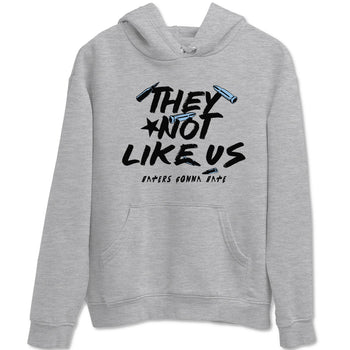 They Not Like Us sneaker match t-shirt styled to complete your fit with the Air Foamposite One Psychic Blue sneakers, shown in Heather Grey 2.