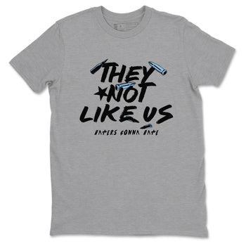They Not Like Us sneaker match t-shirt styled to complete your fit with the Air Foamposite One Psychic Blue sneakers, shown in Heather Grey 2.