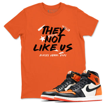 Sneaker match tees – Sneaker Tees To Match Air Jordan 1 Shattered Backboard Shoes – They Not Like Us Tee Orange 1