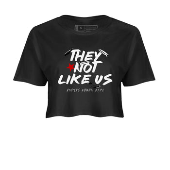 They Not Like Us womens crop tee made to vibe with the Air Jordan 4 White Cement sneakers — the perfect match in Black 2.