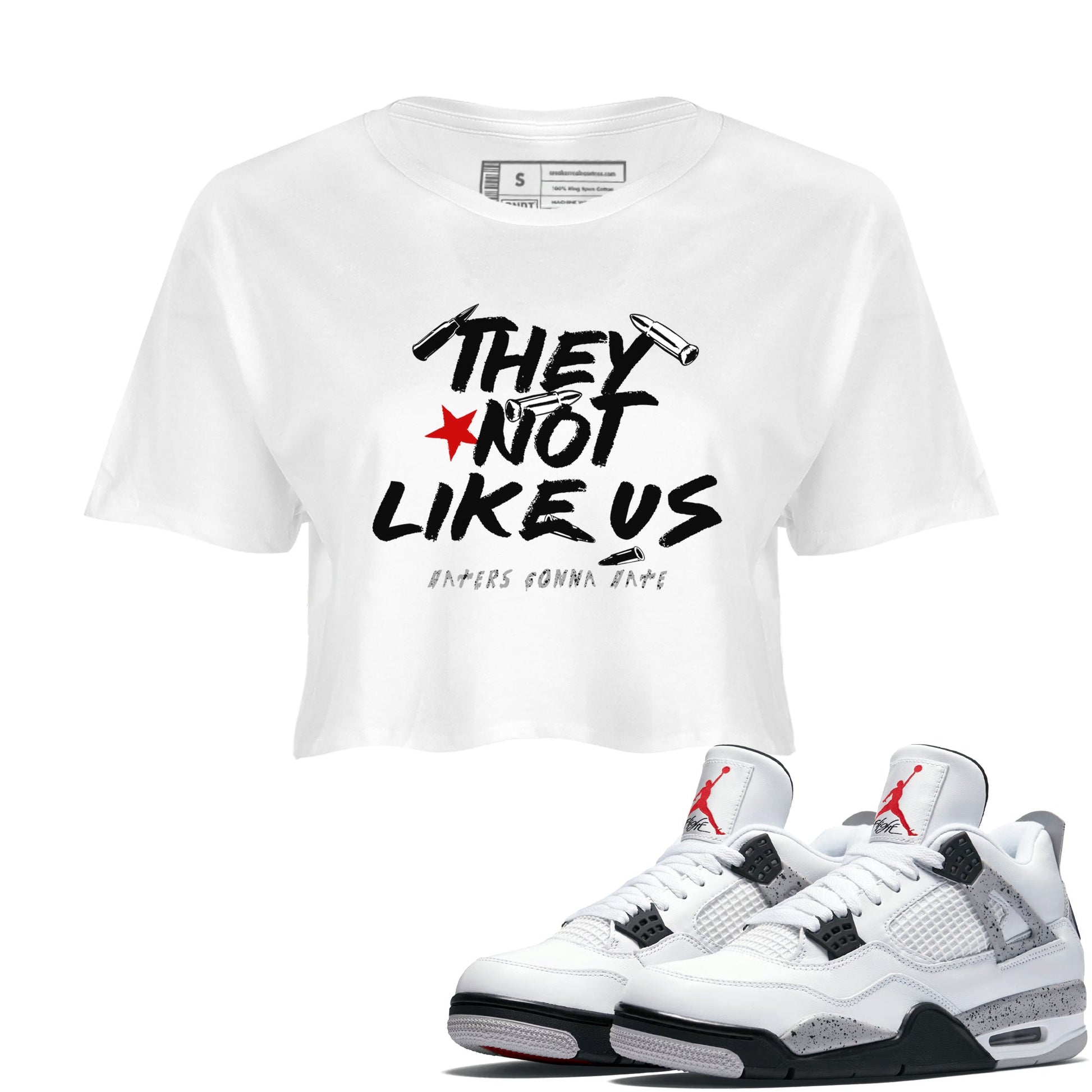 They Not Like Us womens crop tee made to vibe with the Air Jordan 4 White Cement sneakers — the perfect match in White 1.