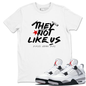 They Not Like Us sneaker match t-shirt styled to complete your fit with the Air Jordan 4 White Cement sneakers, shown in White 1.