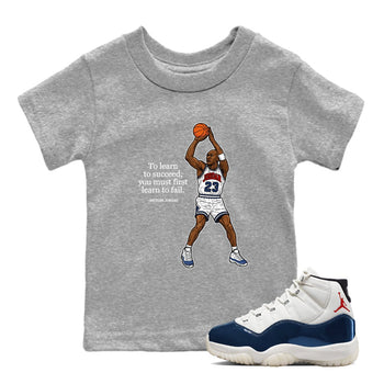 Michael Jordan Quotes To Learn To Succeed You Must First Learn To Fail baby and kids t-shirt crafted for little sneakerheads to shine with the Air Jordan 11 Rare Air sneakers, displayed in Heather Grey 1.