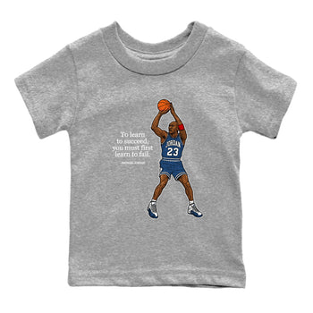Michael Jordan Quotes To Learn To Succeed You Must First Learn To Fail baby and kids t-shirt crafted for little sneakerheads to shine with the Air Jordan 12 French Blue sneakers, displayed in Heather Grey 2.