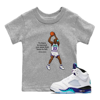 Michael Jordan Quotes To Learn To Succeed You Must First Learn To Fail baby and kids t-shirt crafted for little sneakerheads to shine with the Air Jordan 5 Grape sneakers, displayed in Heather Grey 1.
