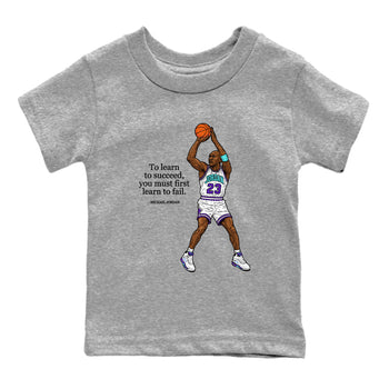 Michael Jordan Quotes To Learn To Succeed You Must First Learn To Fail baby and kids t-shirt crafted for little sneakerheads to shine with the Air Jordan 5 Grape sneakers, displayed in Heather Grey 2.