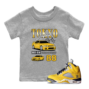 Tokyo Drift Mode baby and kids t-shirt crafted for little sneakerheads to with the Air Jordan 5 Tokyo sneakers, displayed in Heather Grey 1.