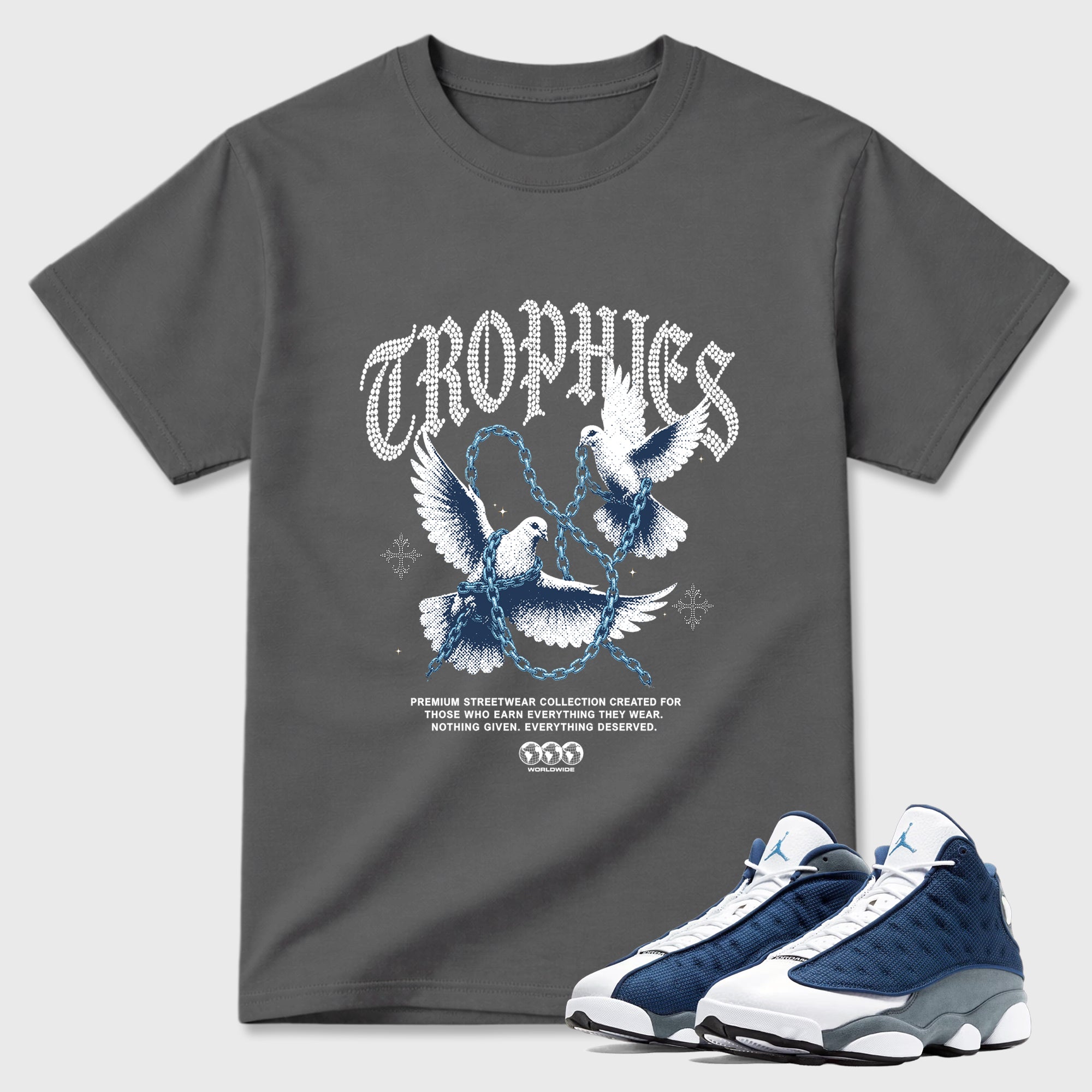 Trophies Graphic T-Shirt featuring original streetwear artwork designed to match the Air Jordan 13 Flint. Cool Grey 1 Graphic T-Shirt.
