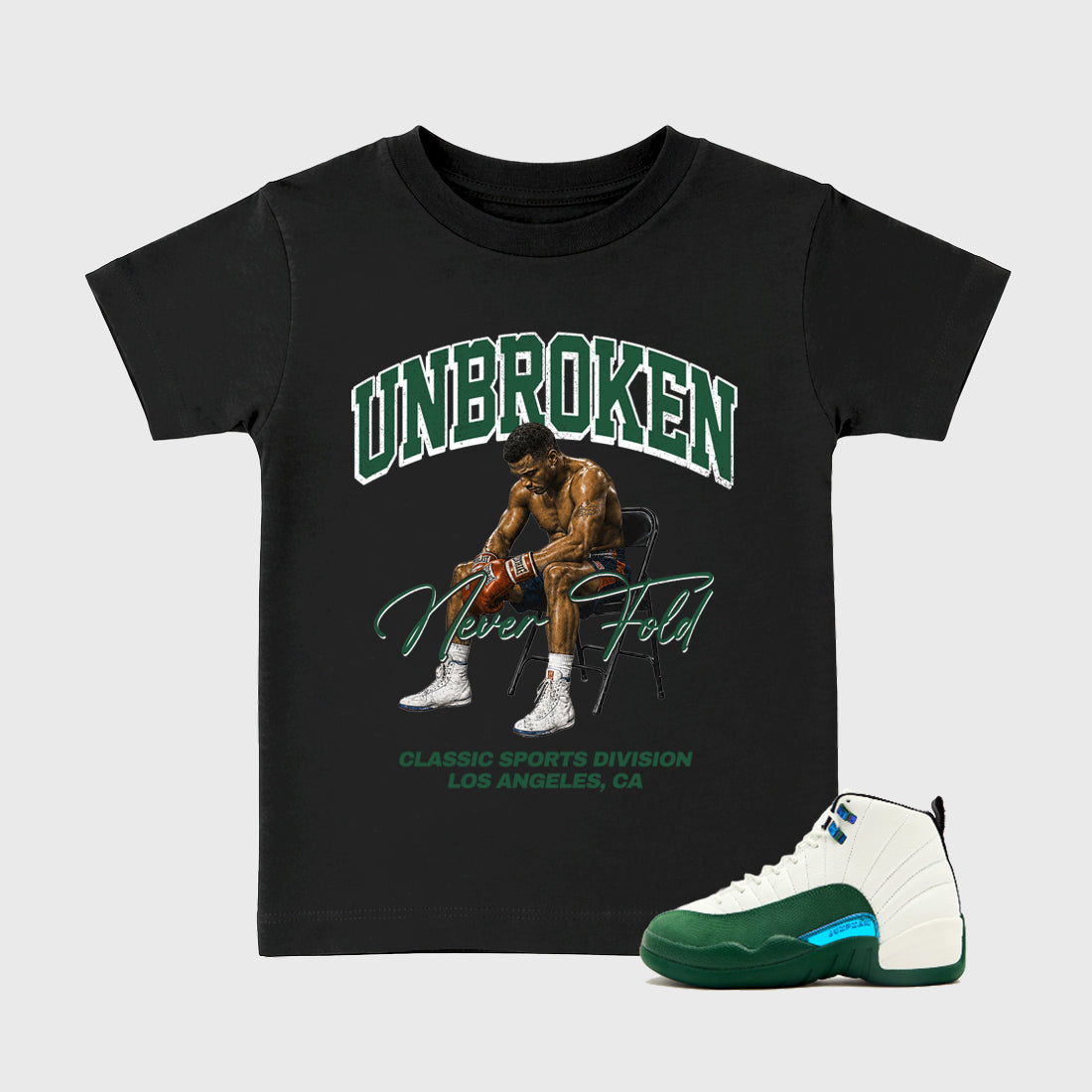 Unbroken Baby & Kids Graphic T-Shirt featuring original artwork designed to match the Air Jordan 12 Summit Green. Black 1 Kids Graphic Tee.