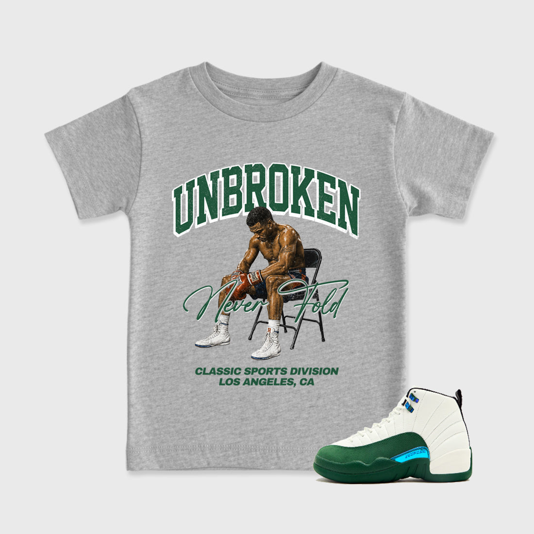 Unbroken Baby & Kids Graphic T-Shirt featuring original artwork designed to match the Air Jordan 12 Summit Green. Heather Grey 1 Kids Graphic Tee.