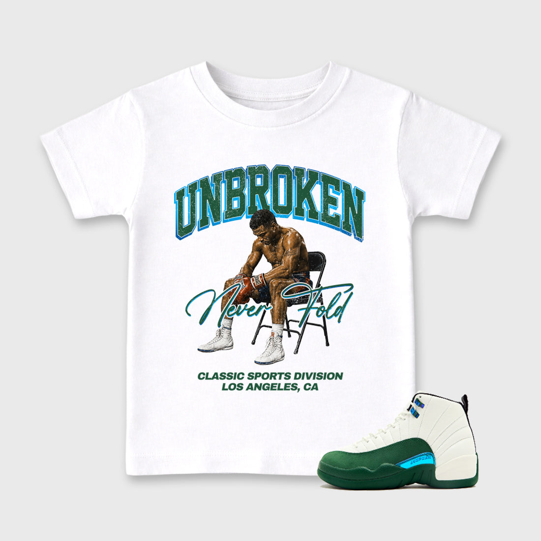 Unbroken Baby & Kids Graphic T-Shirt featuring original artwork designed to match the Air Jordan 12 Summit Green. White 1 Kids Graphic Tee.