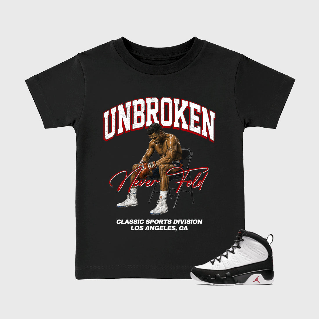 Unbroken Baby & Kids Graphic T-Shirt featuring original artwork designed to match the Air Jordan 9 True Red. Black 1 Kids Graphic Tee.