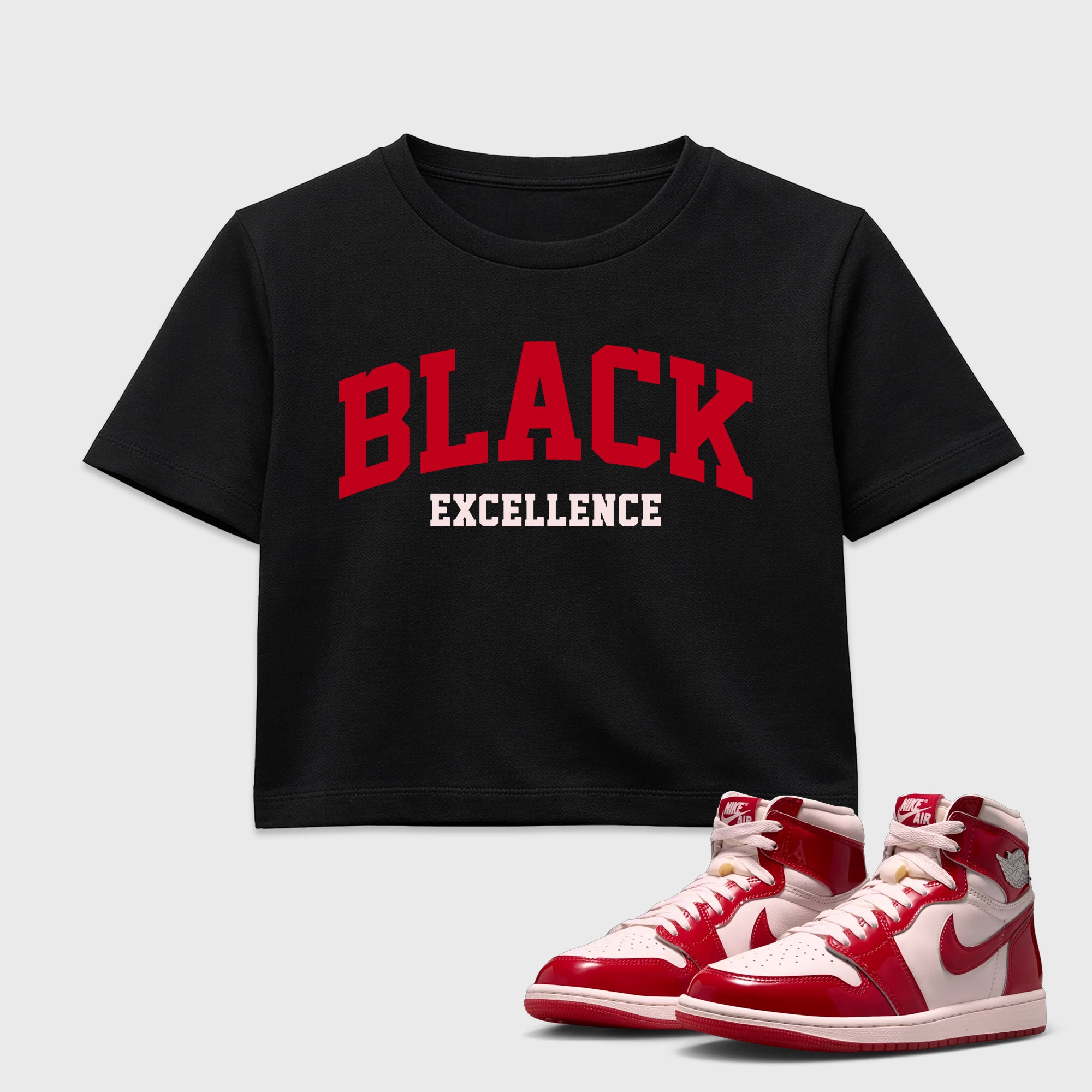 Varsity Black Excellence women’s crop tee designed to match the Air Jordan 1 Nails and Grails, featuring coordinated Black 1 options for a perfect streetwear vibe.