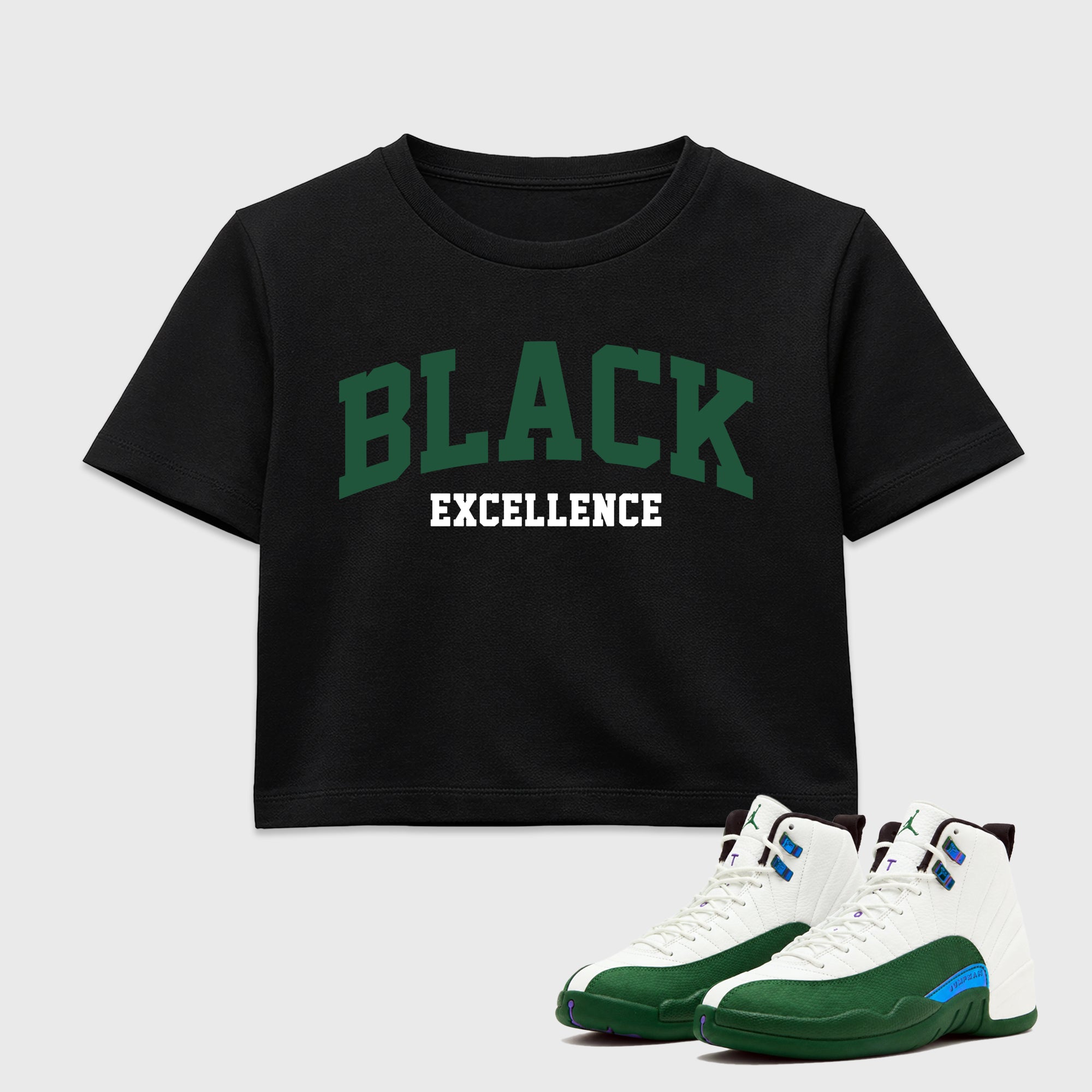 Varsity Black Excellence women’s crop tee designed to match the Air Jordan 12 Summit Green, featuring coordinated Black 1 options for a perfect streetwear vibe.