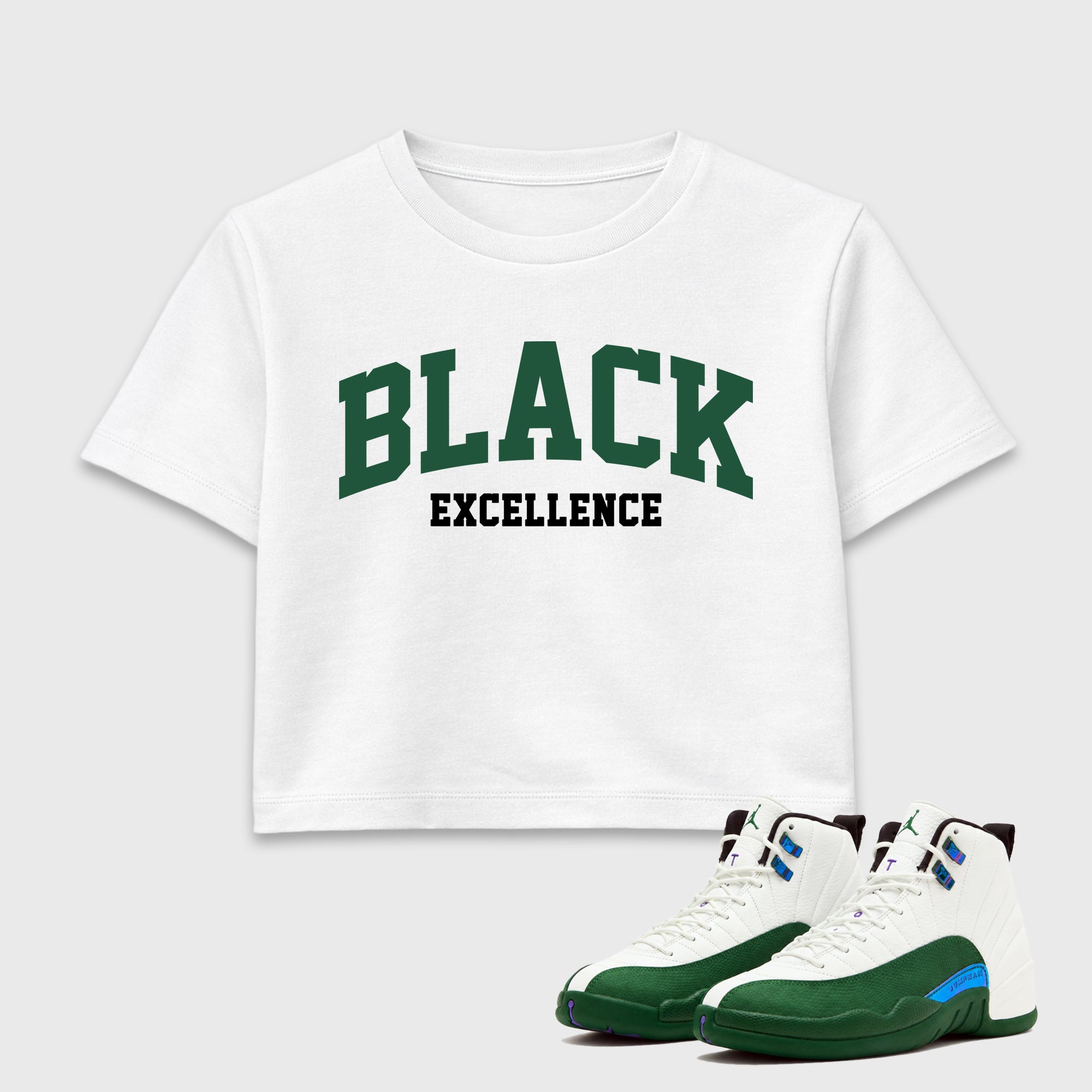 Varsity Black Excellence women’s crop tee designed to match the Air Jordan 12 Summit Green, featuring coordinated White 1 options for a perfect streetwear vibe.
