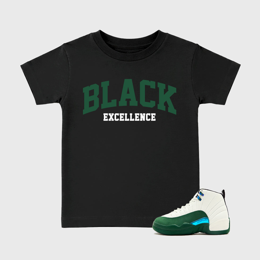 Varsity Black Excellence Baby & Kids Graphic T-Shirt featuring original artwork designed to match the Air Jordan 12 Summit Green. Black 1 Kids Graphic Tee.