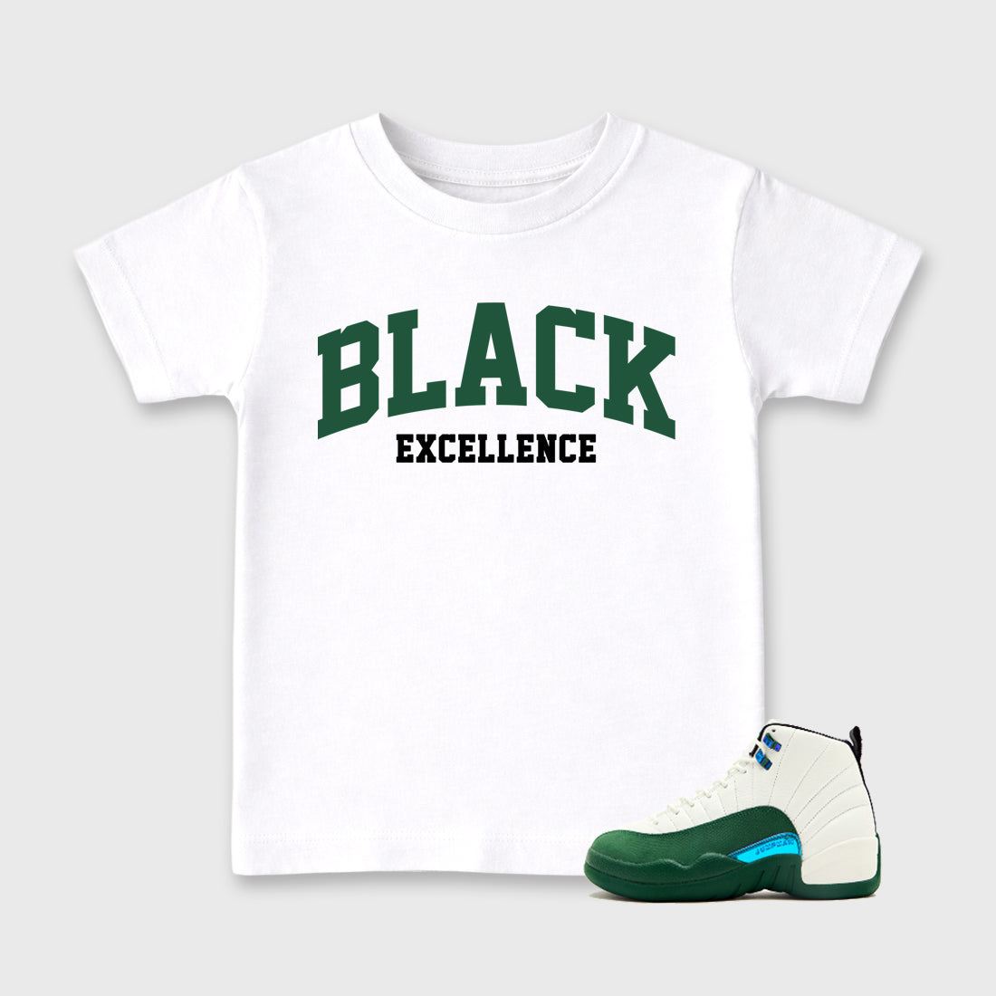 Varsity Black Excellence Baby & Kids Graphic T-Shirt featuring original artwork designed to match the Air Jordan 12 Summit Green. White 1 Kids Graphic Tee.