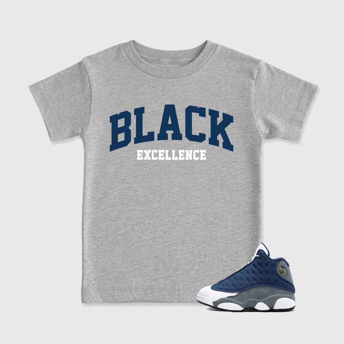 Varsity Black Excellence Baby & Kids Graphic T-Shirt featuring original artwork designed to match the Air Jordan 13 Flint. Heather Grey 1 Kids Graphic Tee.