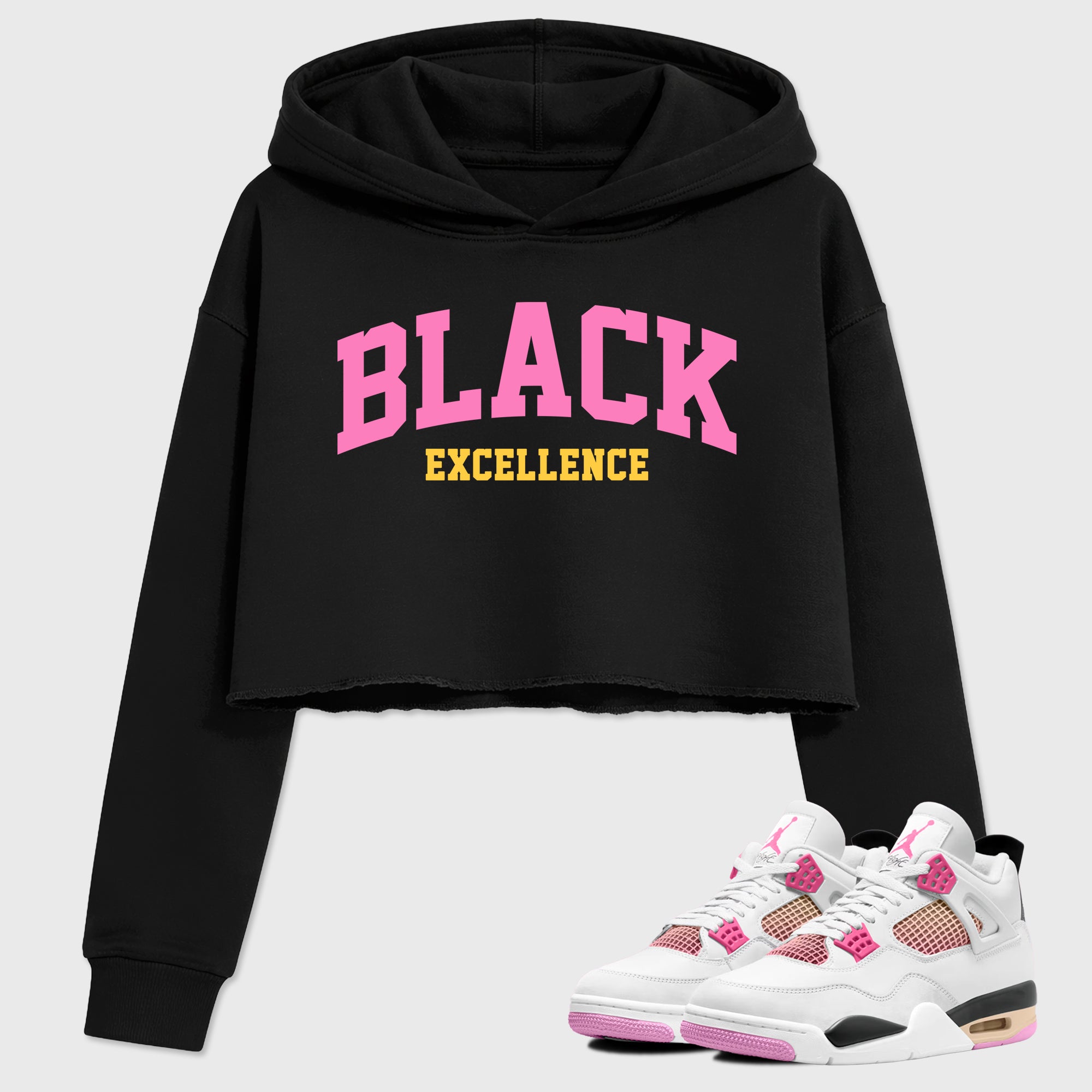 Varsity Black Excellence Women’s Graphic Crop Tee featuring original streetwear artwork designed to match the Air Jordan 4 Comic. Black 1 Crop Tee.