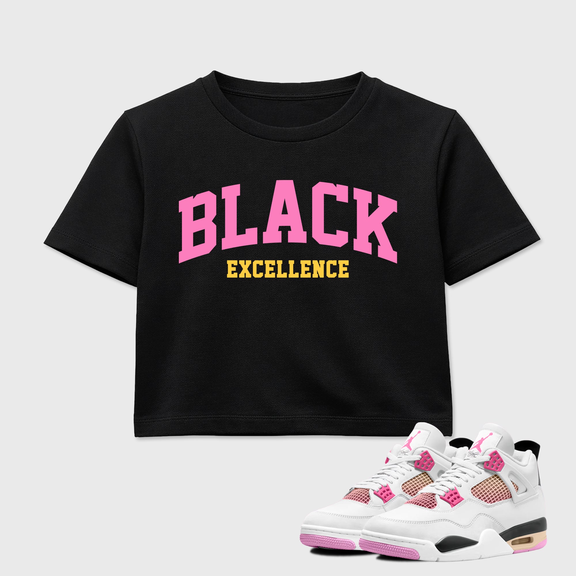 Varsity Black Excellence women’s crop tee designed to match the Air Jordan 4 Comic, featuring coordinated Black 1 options for a perfect streetwear vibe.