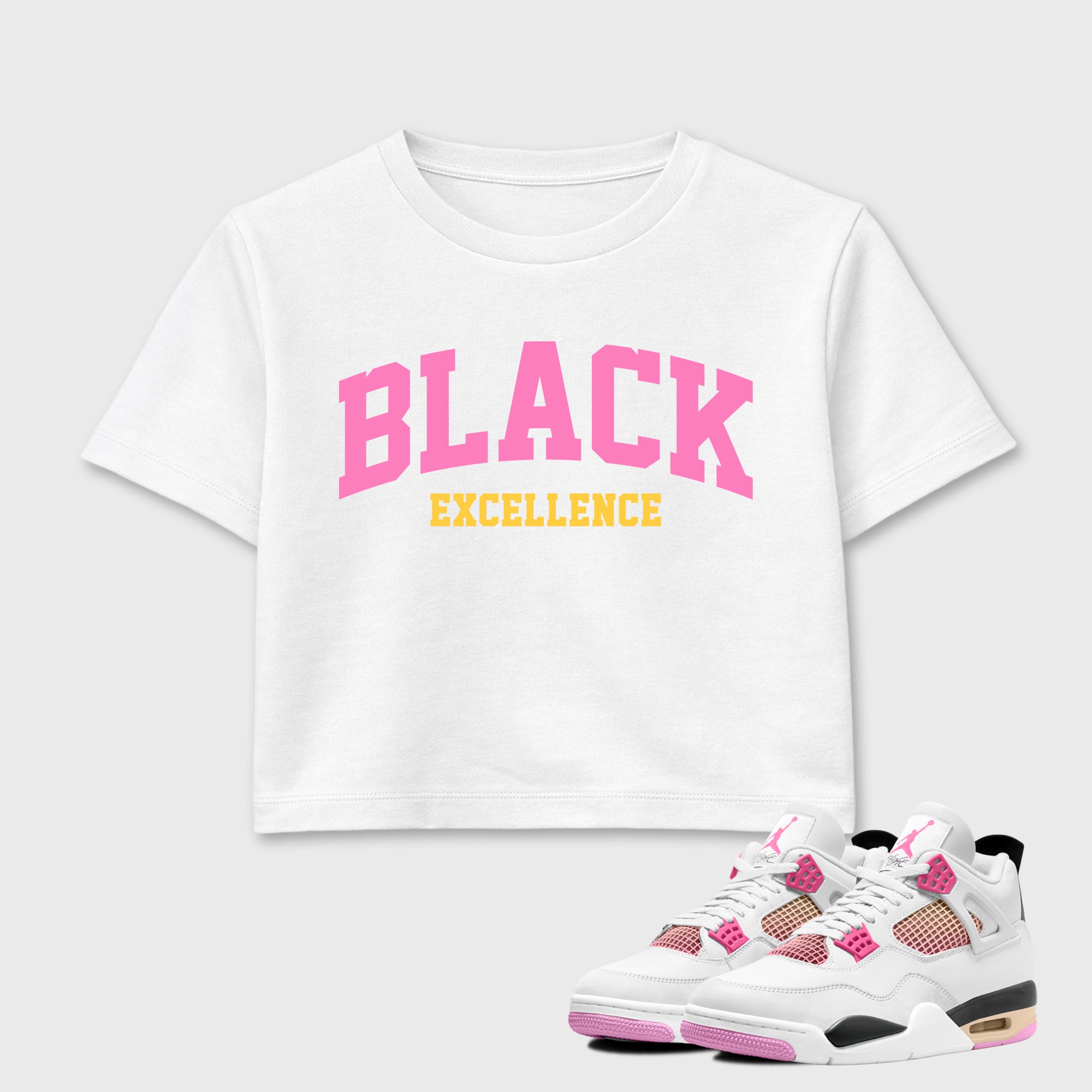 Varsity Black Excellence women’s crop tee designed to match the Air Jordan 4 Comic, featuring coordinated White 1 options for a perfect streetwear vibe.