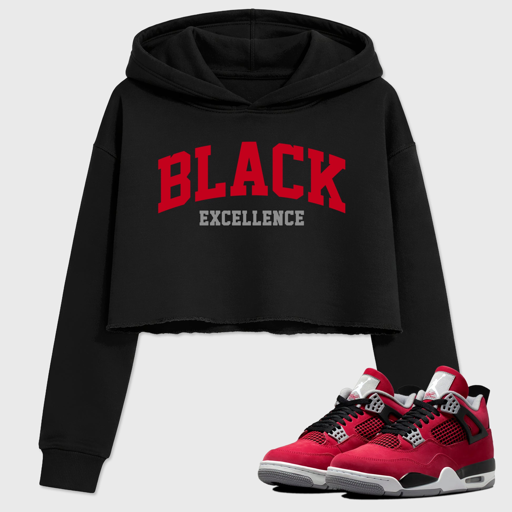 Varsity Black Excellence women’s crop tee designed to match the Air Jordan 4 Toro Bravo, featuring coordinated Black 1 options for a perfect streetwear vibe.