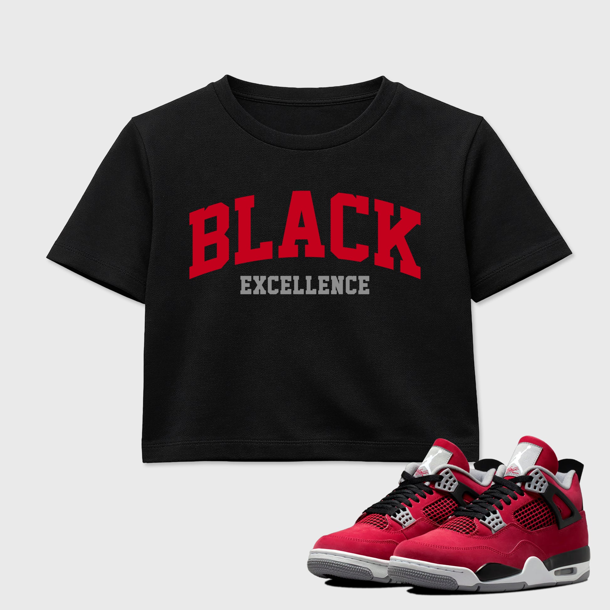 Varsity Black Excellence women’s crop tee designed to match the Air Jordan 4 Toro Bravo, featuring coordinated Black 1 options for a perfect streetwear vibe.