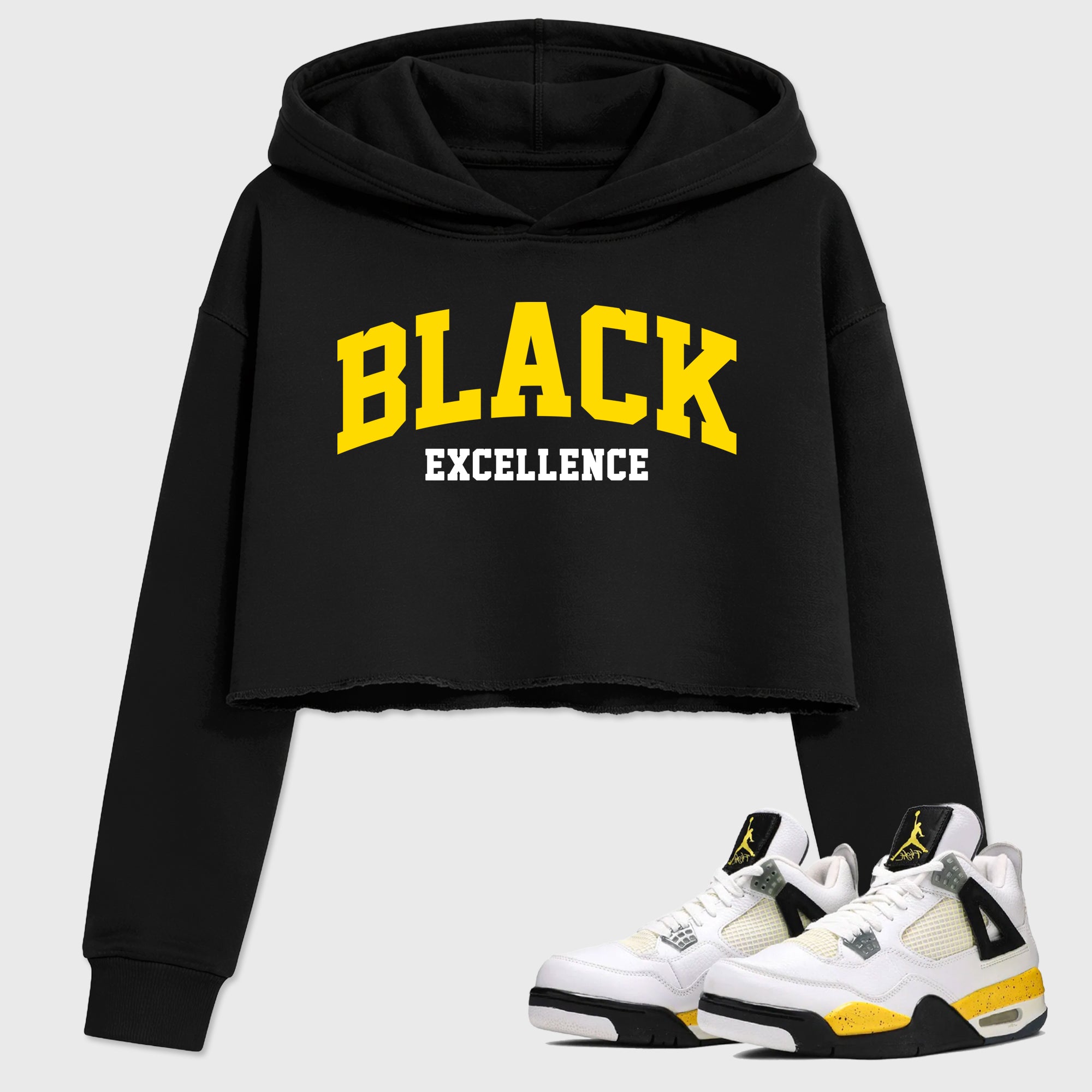 Varsity Black Excellence Women’s Graphic Crop Tee featuring original streetwear artwork designed to match the Air Jordan 4 Tour Yellow. Black 1 Crop Tee.