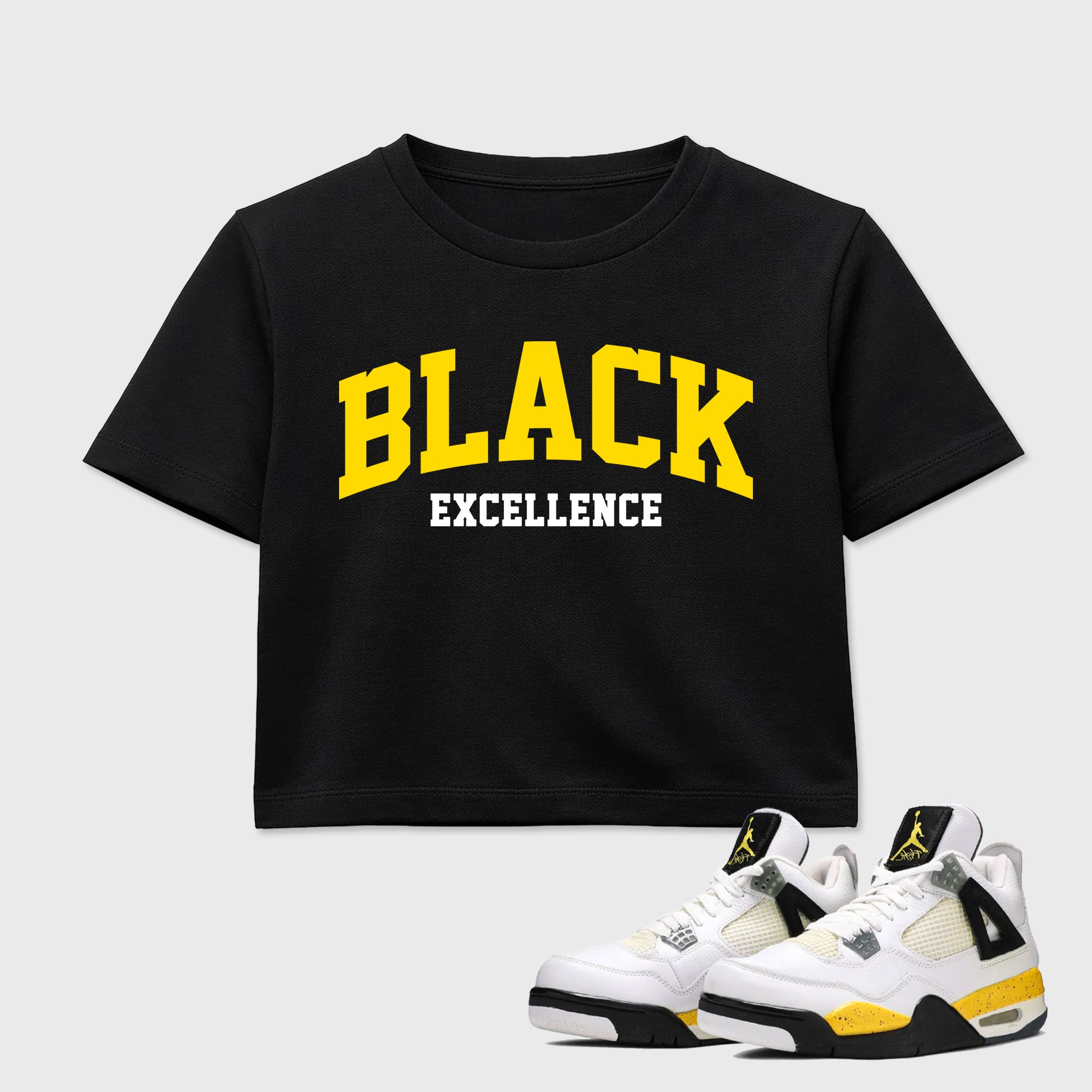 Varsity Black Excellence women’s crop tee designed to match the Air Jordan 4 Tour Yellow, featuring coordinated Black 1 options for a perfect streetwear vibe.