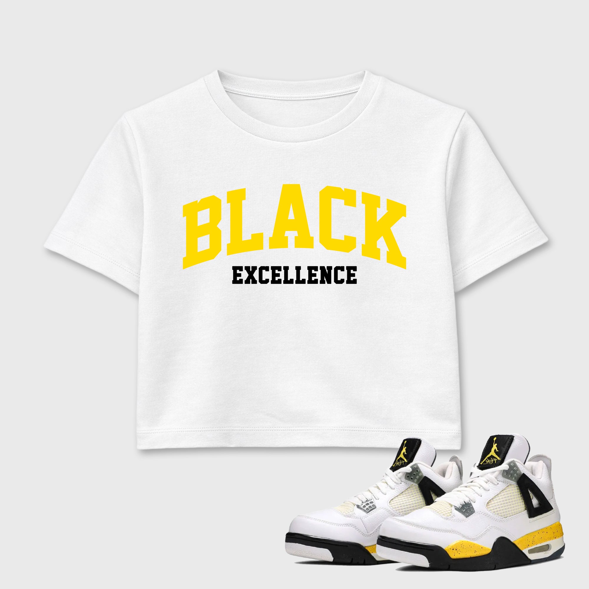 Varsity Black Excellence women’s crop tee designed to match the Air Jordan 4 Tour Yellow, featuring coordinated White 1 options for a perfect streetwear vibe.