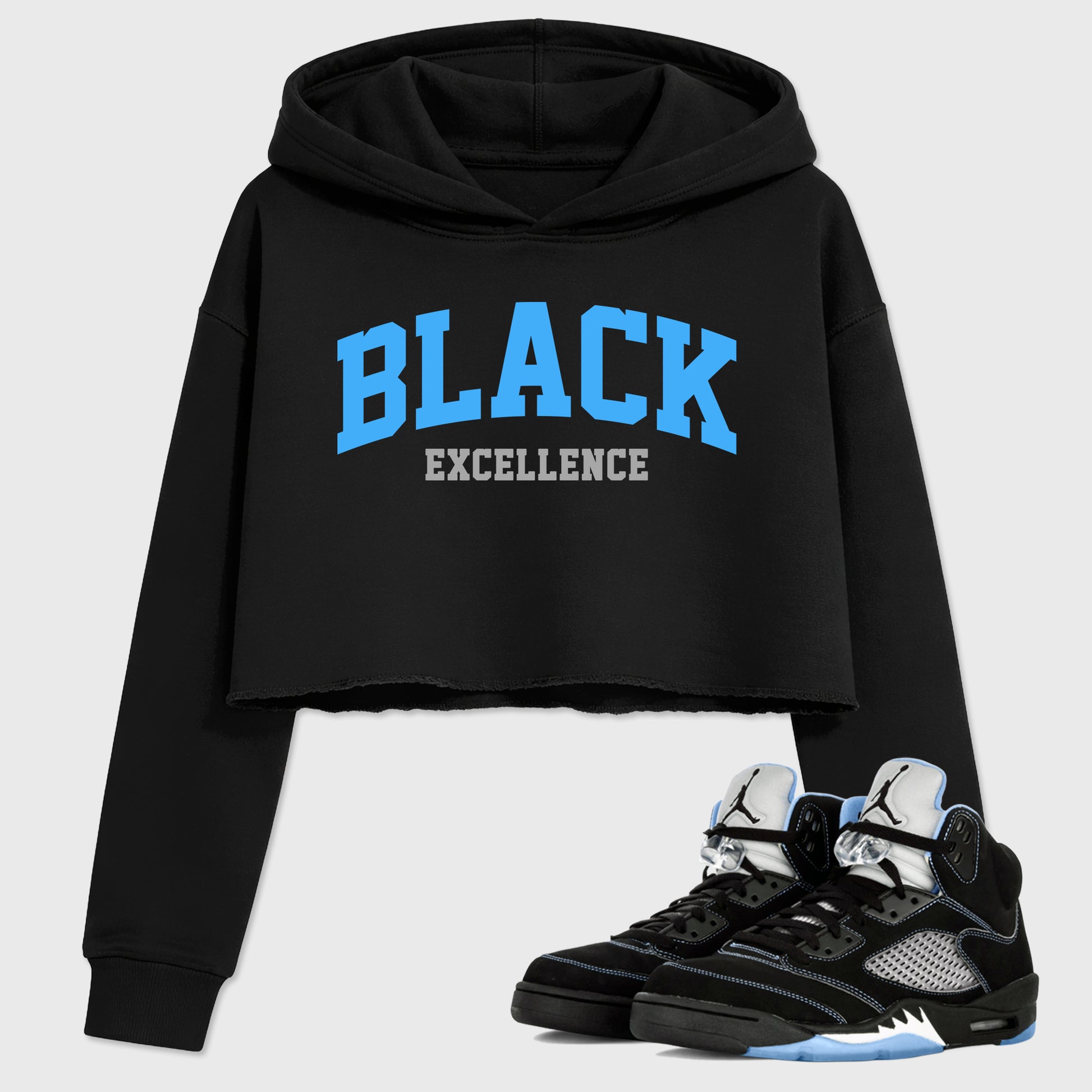 Varsity Black Excellence women’s crop tee designed to match the Air Jordan 5 Black University Blue, featuring coordinated Black 1 options for a perfect streetwear vibe.