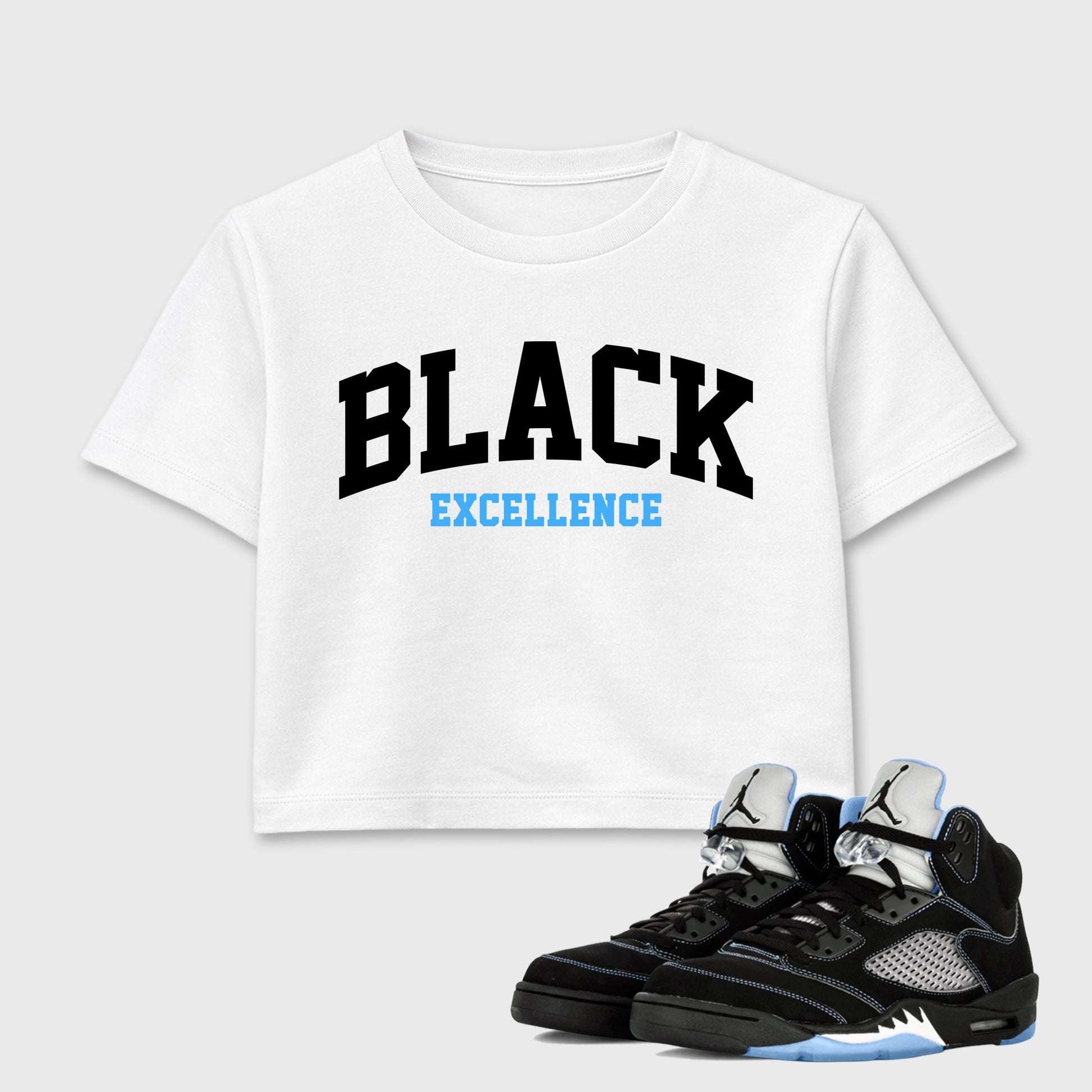 Varsity Black Excellence women’s crop tee designed to match the Air Jordan 5 Black University Blue, featuring coordinated White 1 options for a perfect streetwear vibe.