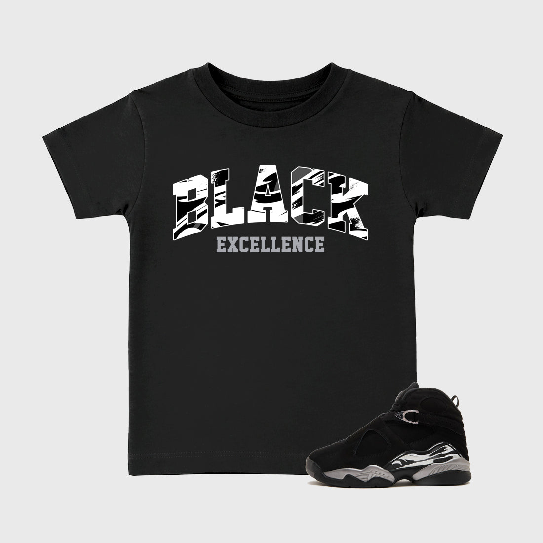Varsity Black Excellence Baby & Kids Graphic T-Shirt featuring original artwork designed to match the Air Jordan 8 Chrome. Black 1 Kids Graphic Tee.